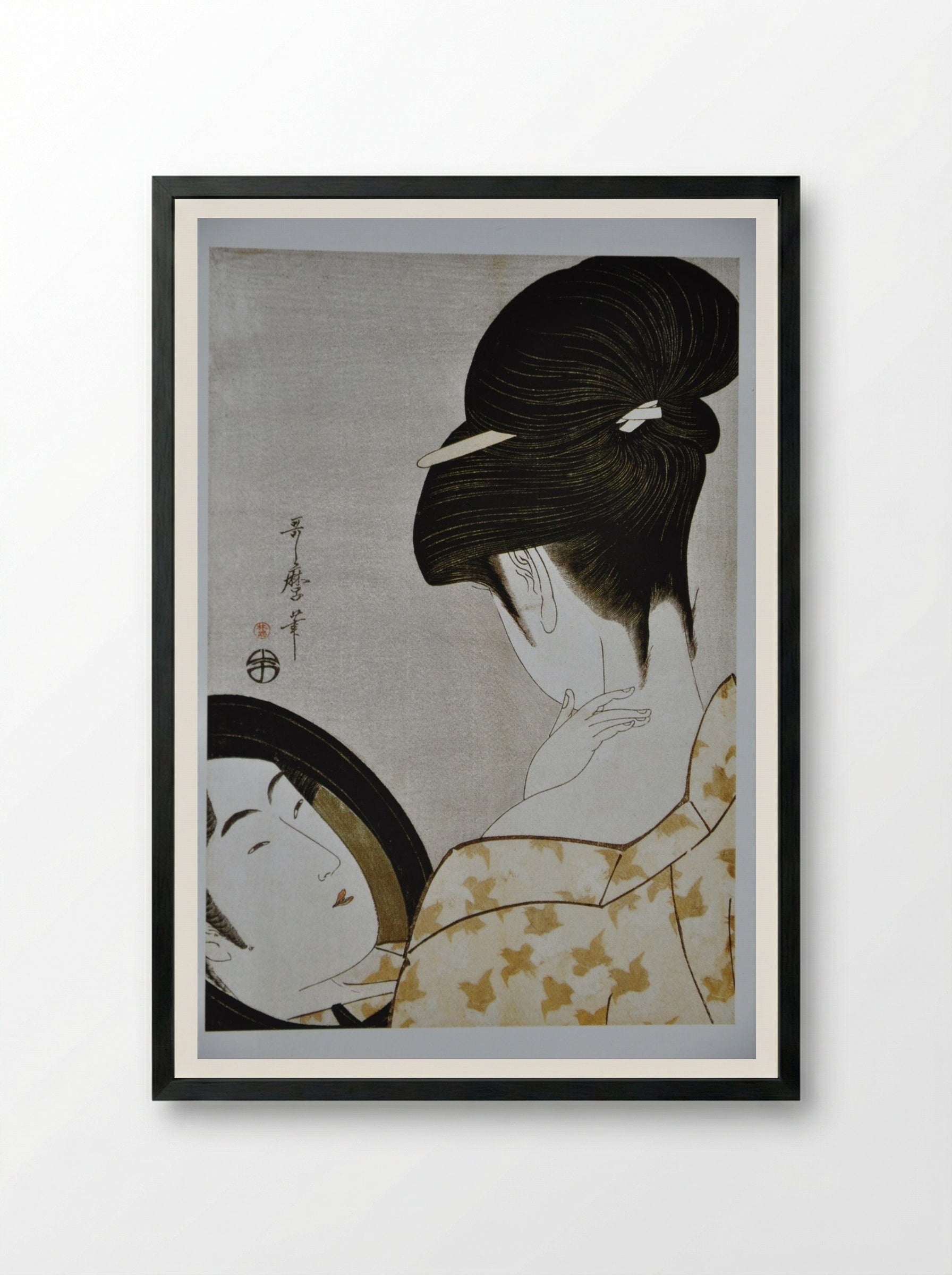 Young Woman Applying Makeup - Kitagawa Utamaro - Framed Print Black