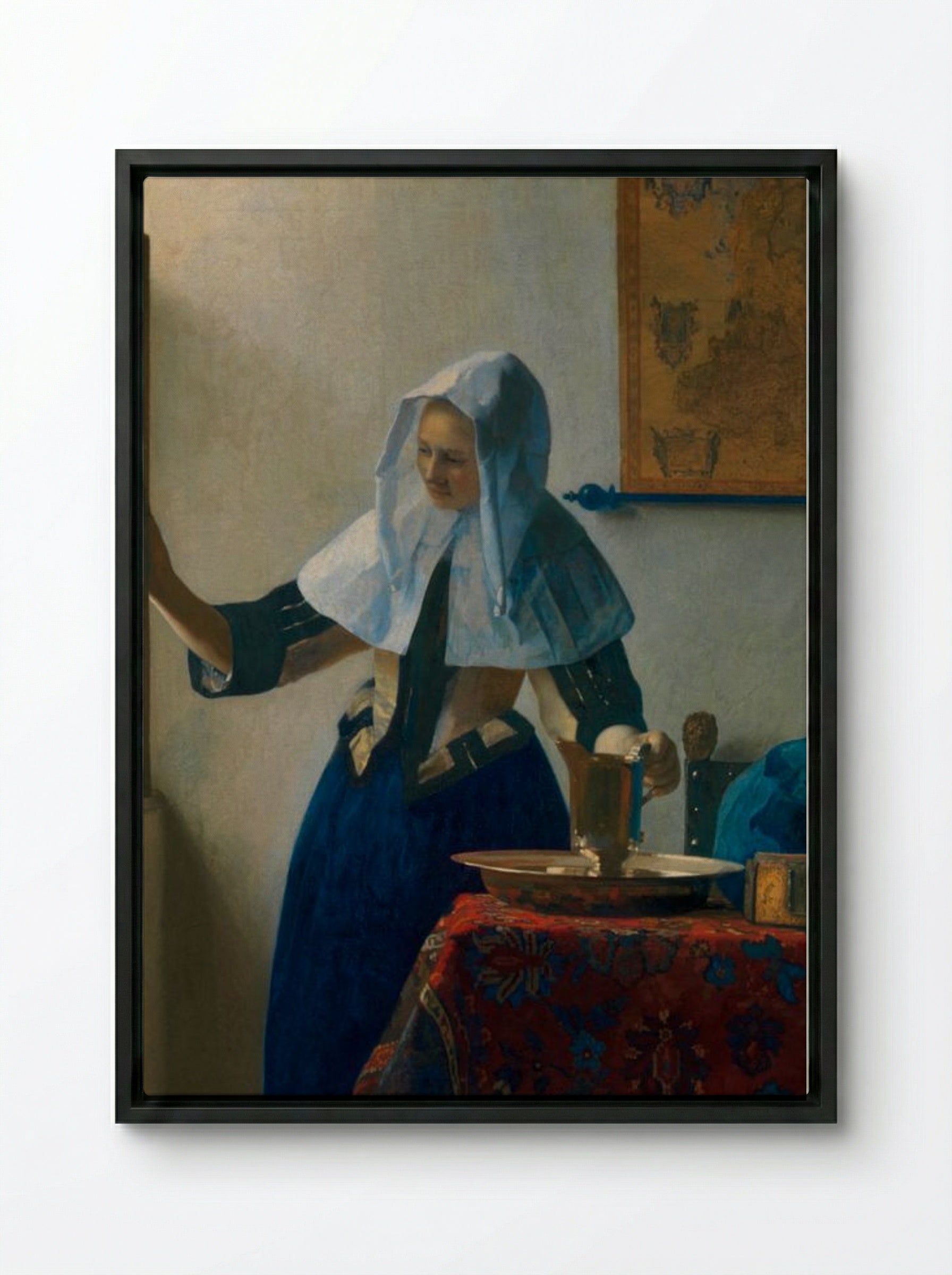 Young Woman with a Water Pitcher - Johannes Vermeer - Framed Canvas Black