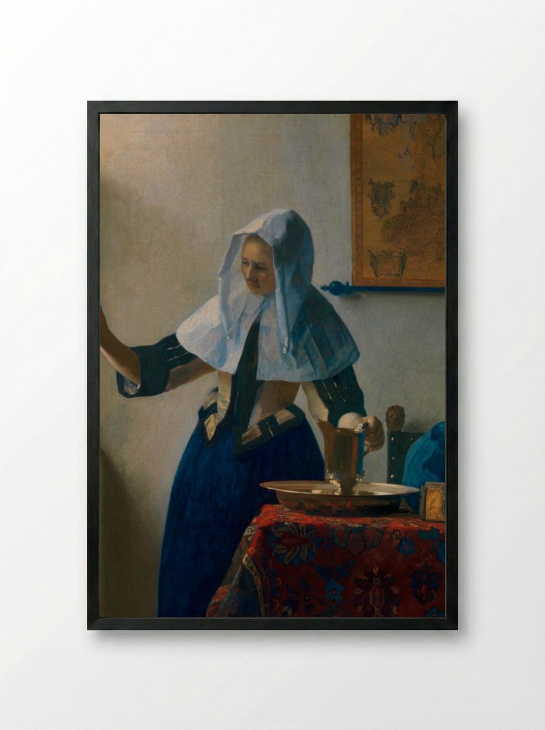 Young Woman with a Water Pitcher - Johannes Vermeer - Framed Print Black