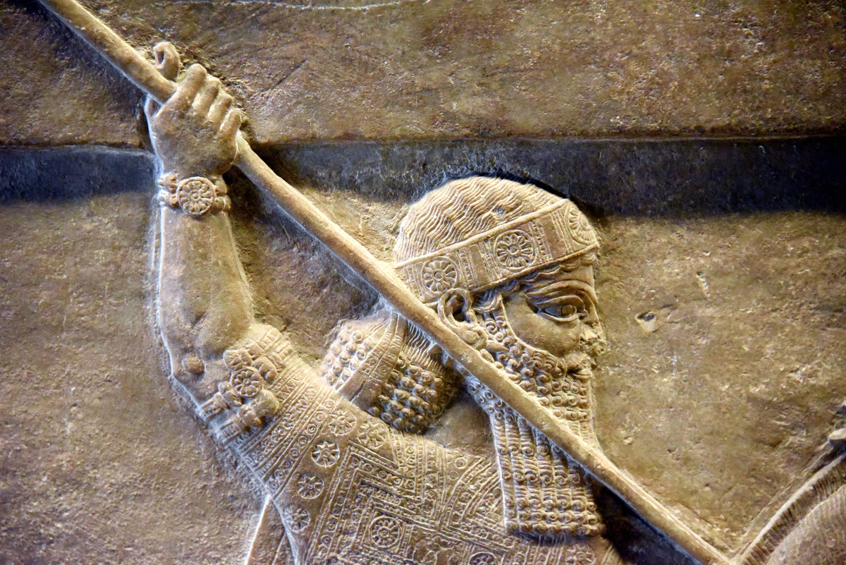 Assyrian king Ashurbanipal, detail of a lion-hunt scene from Ninevah, Iraq. British Museum