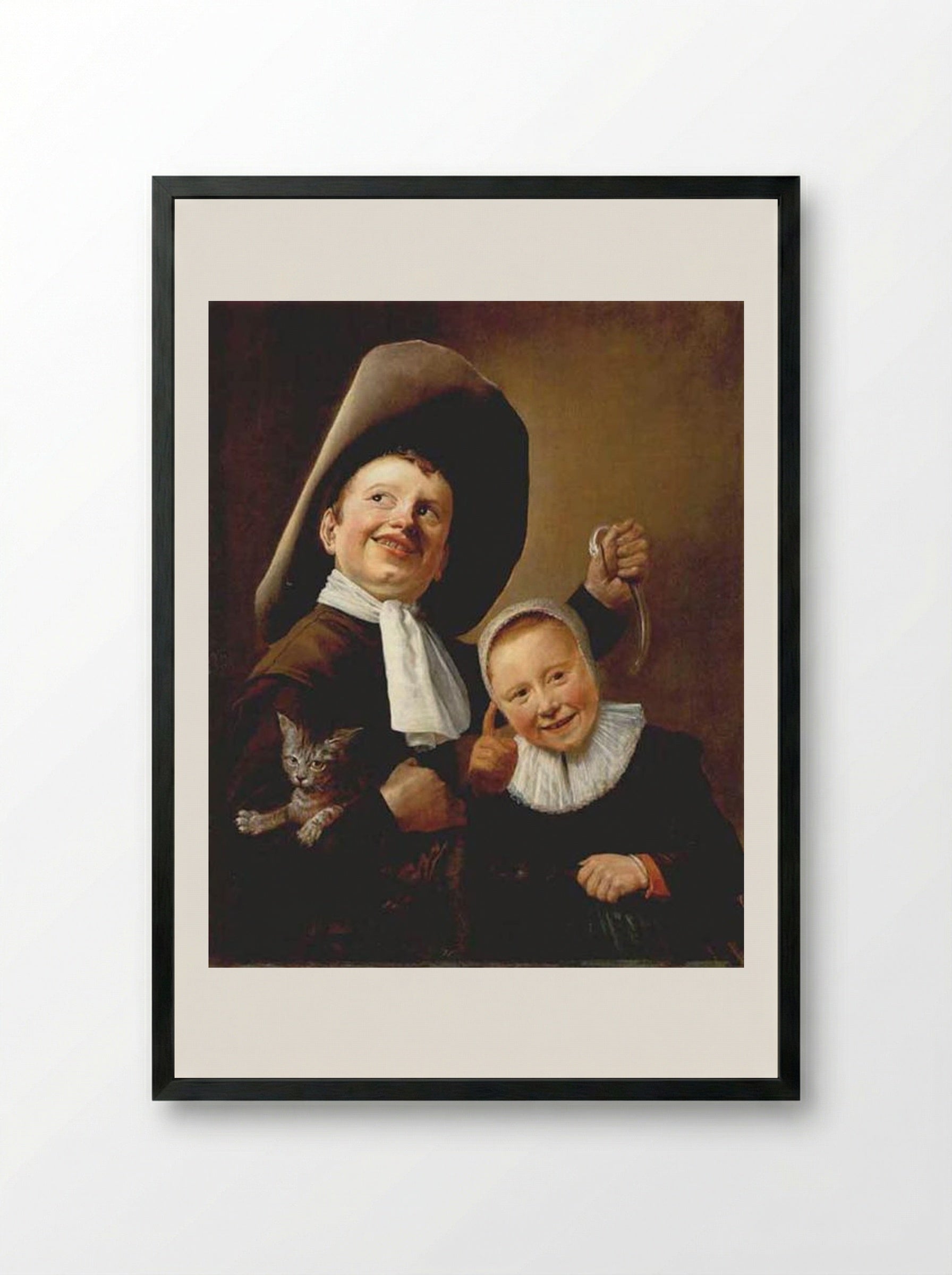 A Boy and a Girl with a Cat and an Eel - Judith Leyster - Framed Print Black