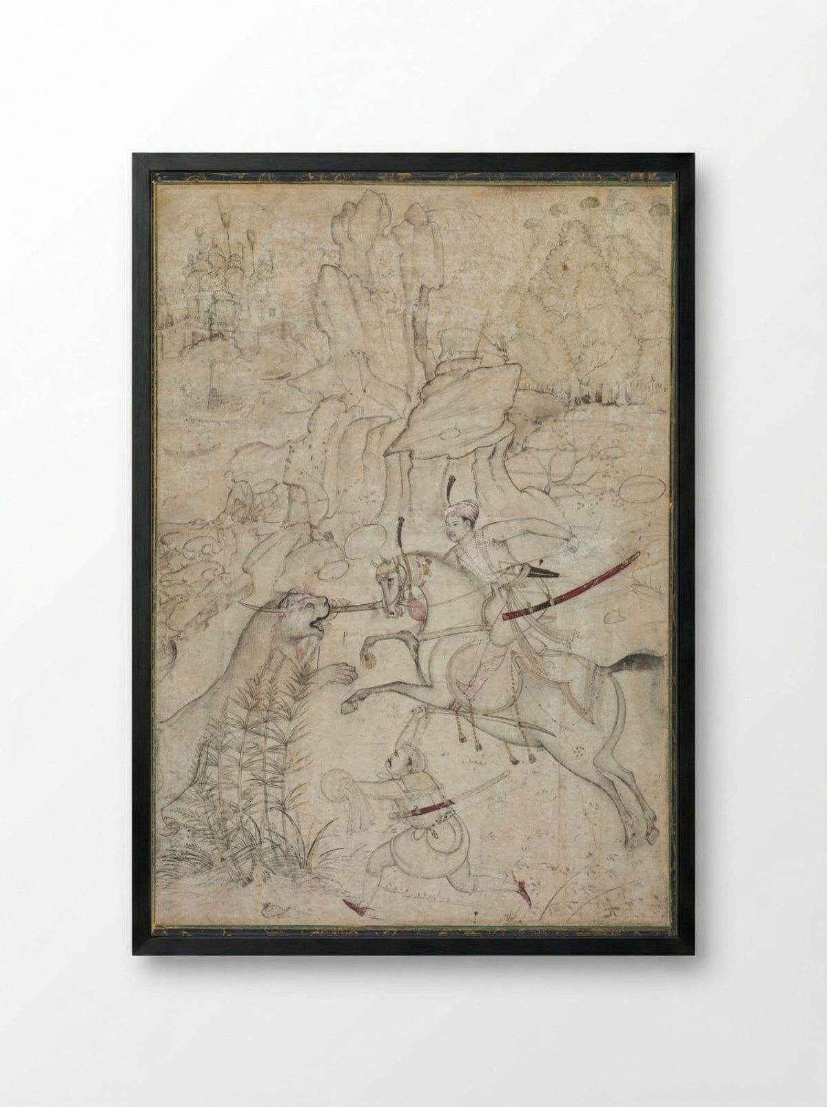 A Mounted Prince Hunting Lion in a Rocky Landscape - Khem Karan - Framed Print Black