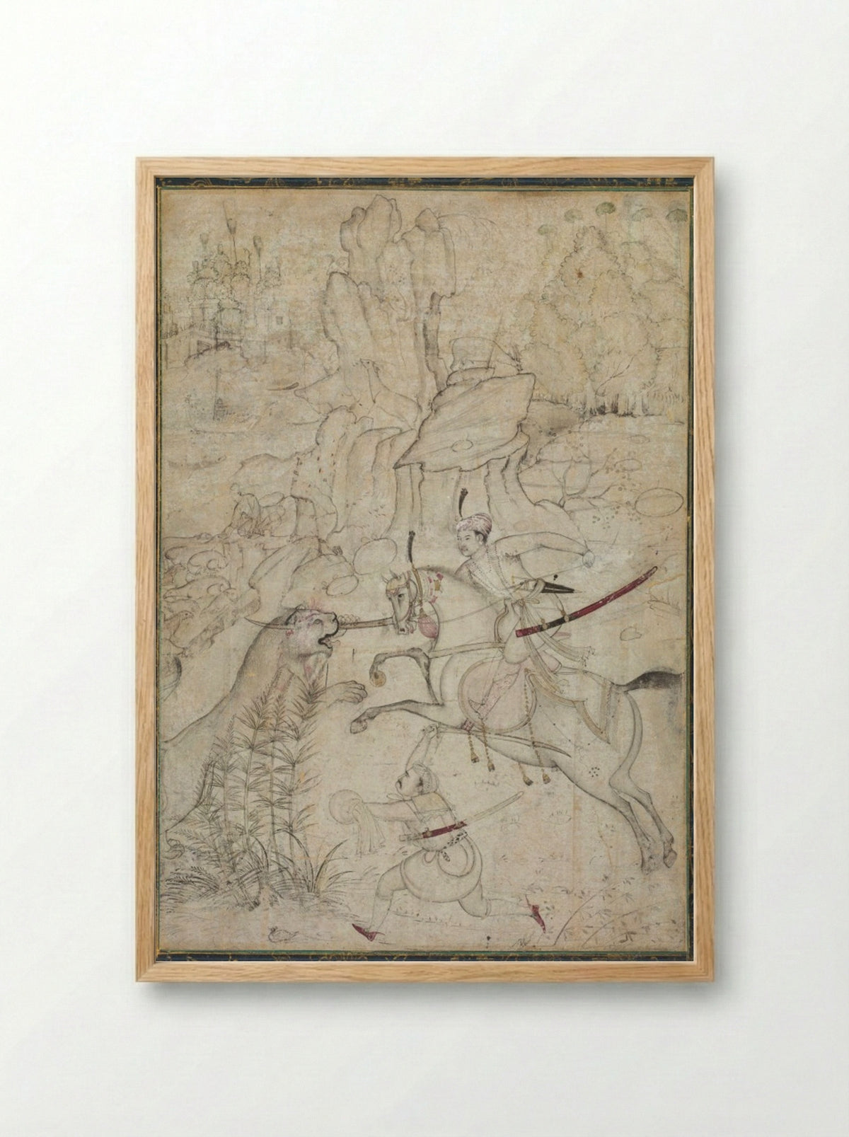 A Mounted Prince Hunting Lion in a Rocky Landscape - Khem Karan - Framed Print Wood