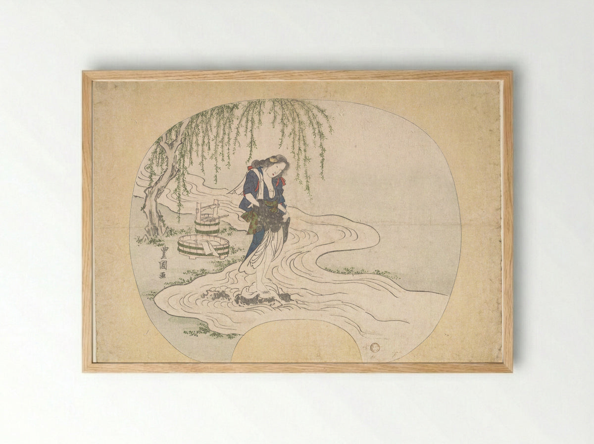 A Woman Stands on a Rock in a Stream Washing Clothes - Utagawa Toyoshige - Framed Print Wood