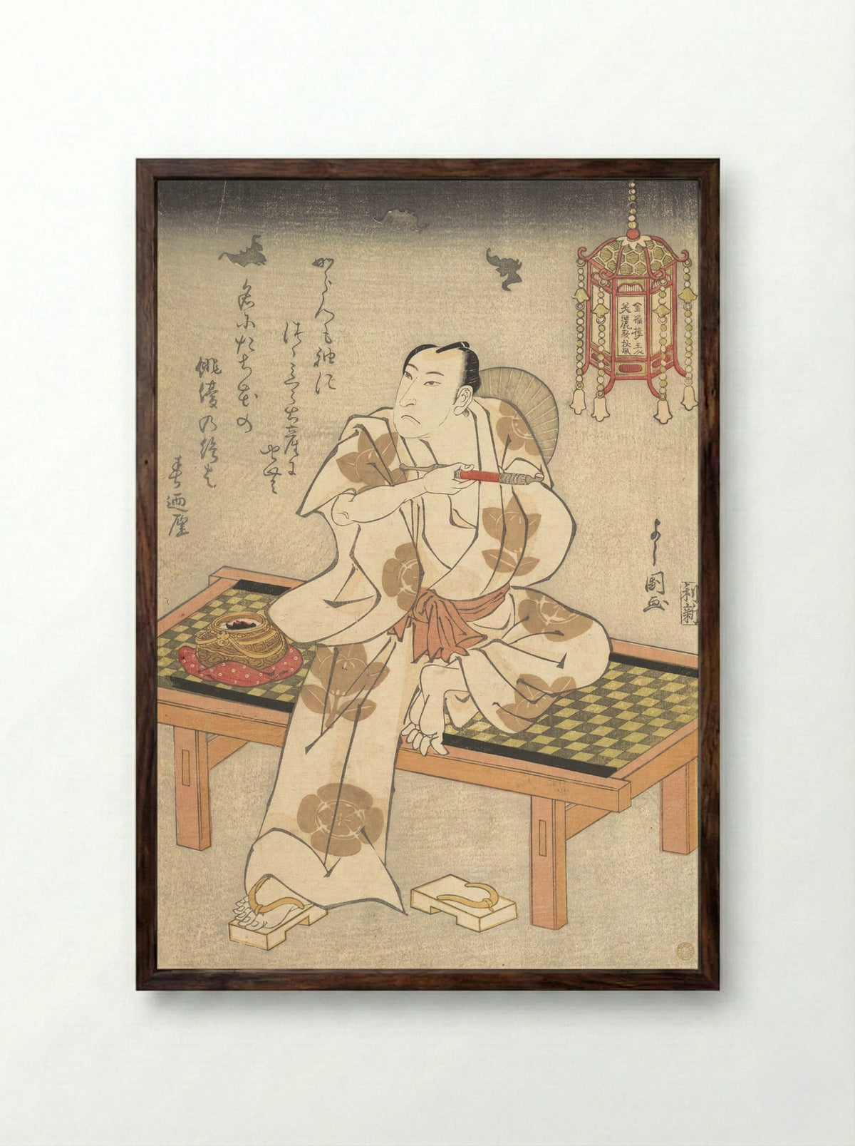 An Actor of the Ichimura Line Sitting on a Shogi (Wooden Bench) and Holding a Pipe - Ippyotei Yoshikuni - Framed Print Dark Wood