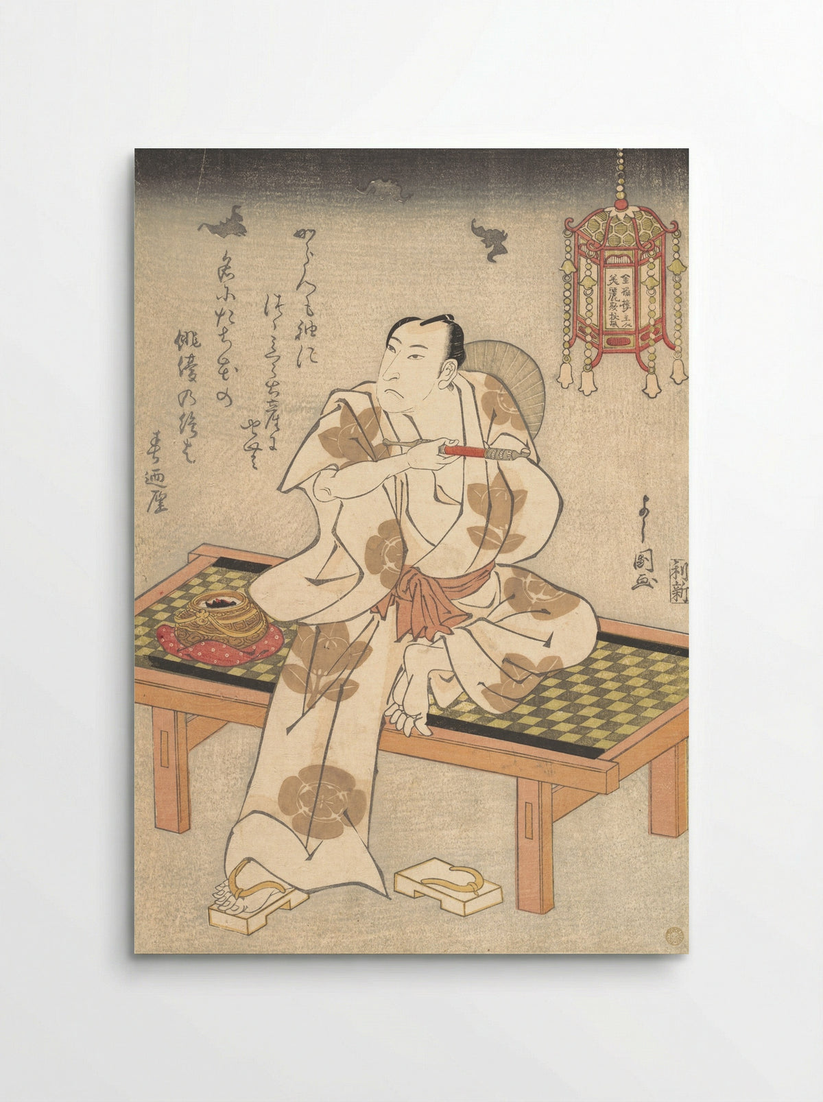 An Actor of the Ichimura Line Sitting on a Shogi (Wooden Bench) and Holding a Pipe - Ippyotei Yoshikuni - Poster