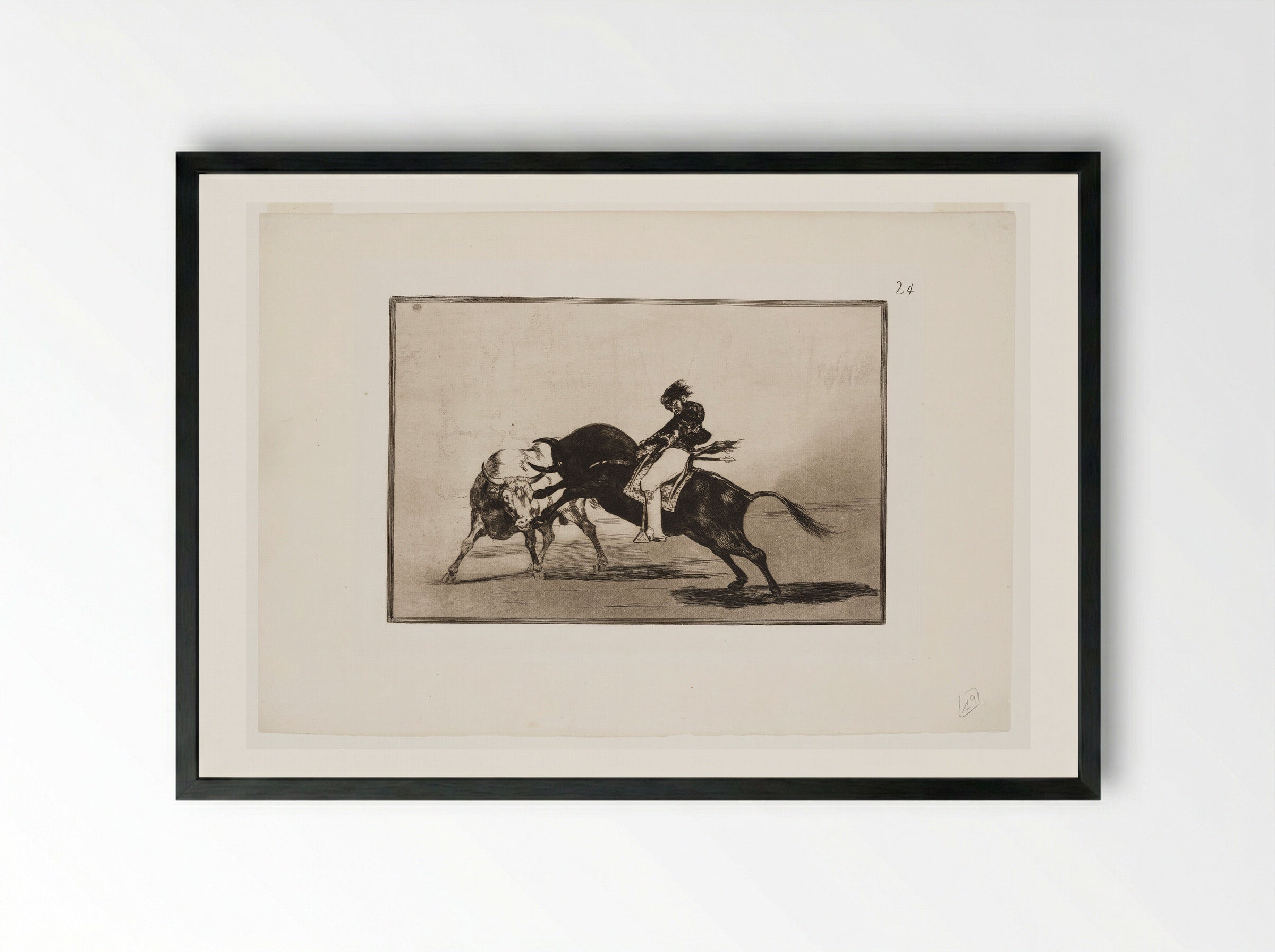 Ceballos Mounted on a Bull Breaks Short Spears in the Ring at Madrid - Francisco José de Goya y Lucientes - Framed Print Black