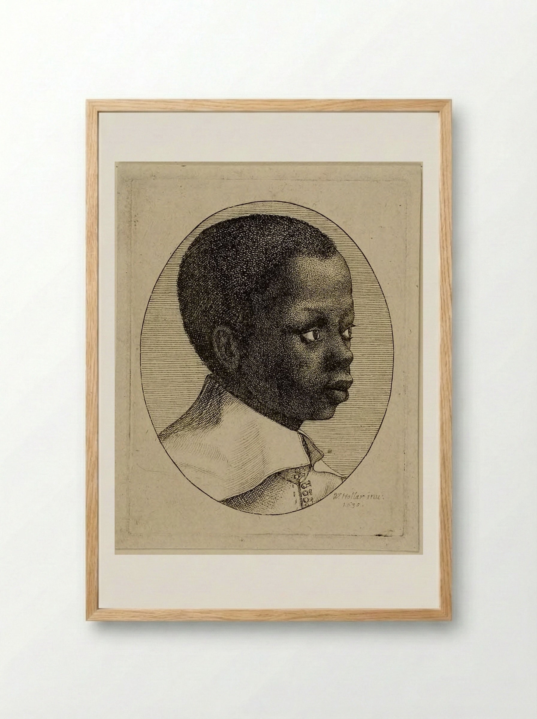Head of a Young Black Boy in Profile to Right in an Oval - Wenceslaus Hollar - Framed Print Wood