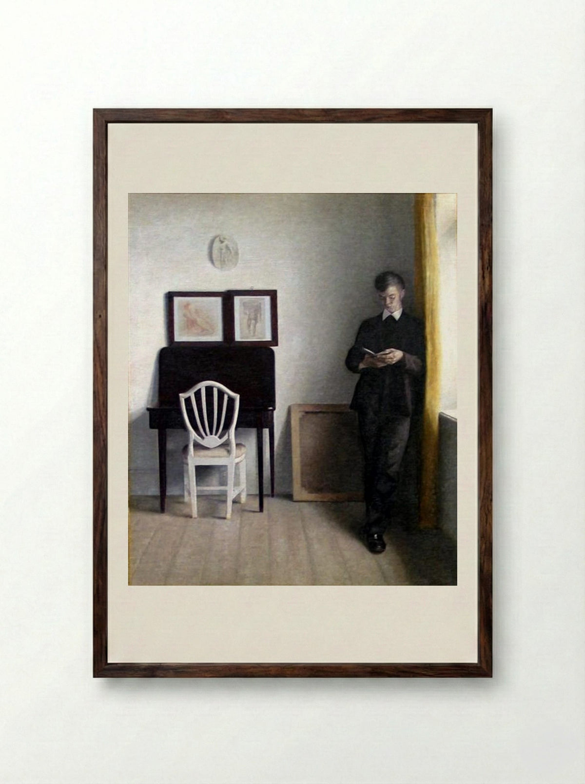 Interior with Young Man Reading - Vilhelm Hammershoi - Framed Print Dark Wood