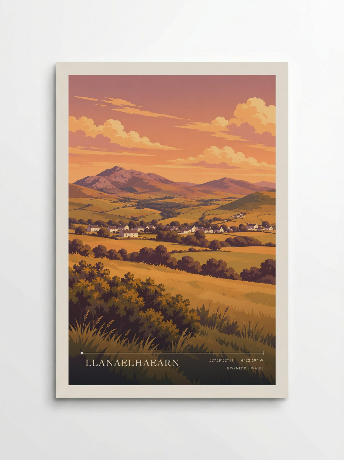 Llanaelhaearn, Gwynedd travel poster: white cottages, gold fields and a rocky mountain skyline beneath the peach and orange colours of evening