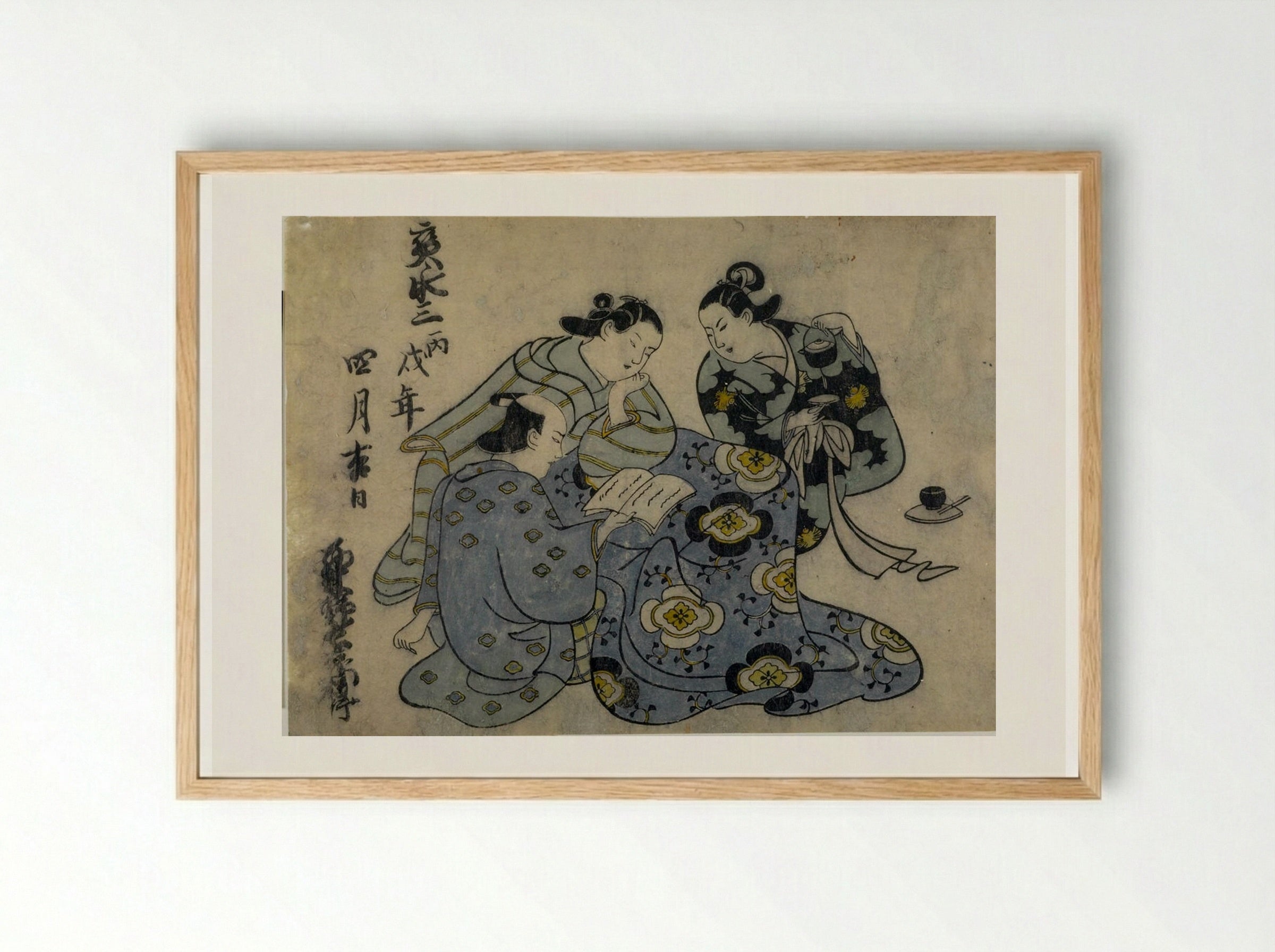Man and Two Women Reading - Okumura Masanobu - Framed Print Wood
