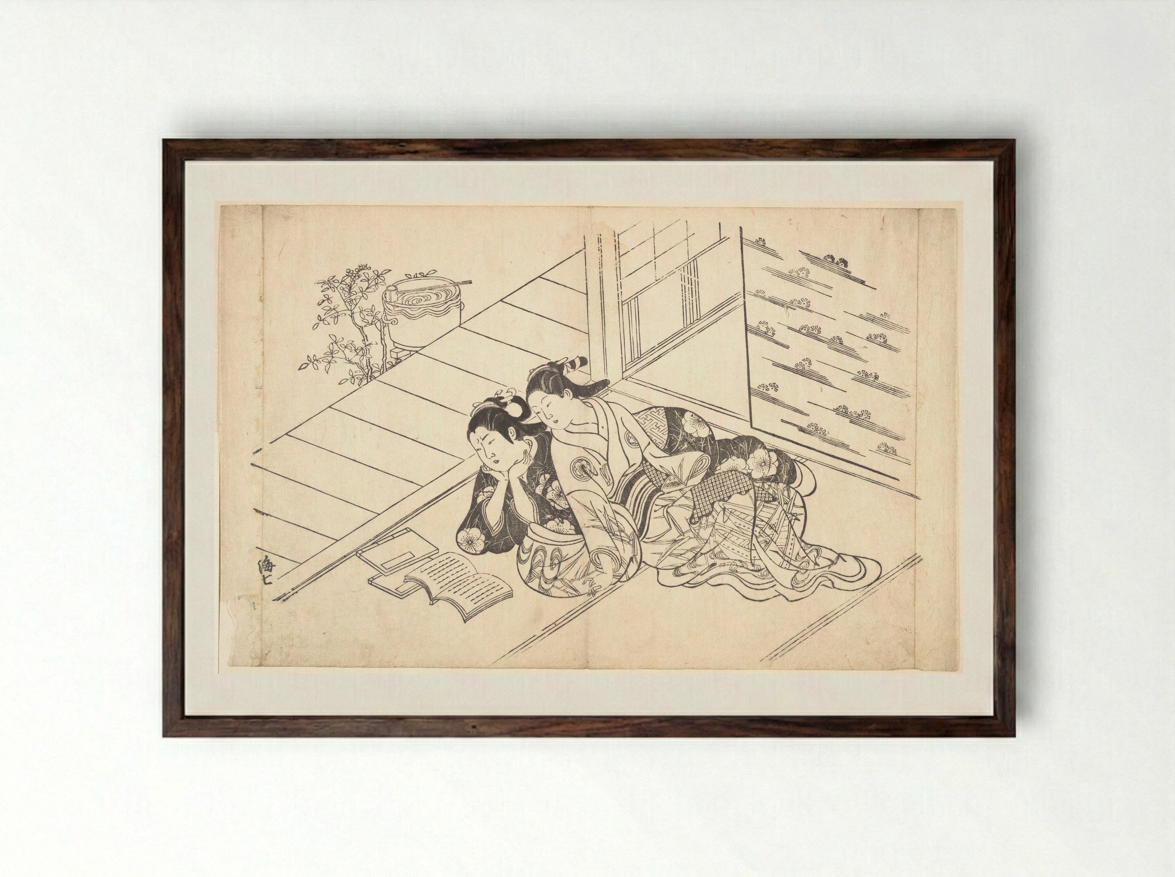 Two Women Reclining on the Floor of a Room and Reading a Book - Nishikawa Sukenobu - Framed Print Dark Wood