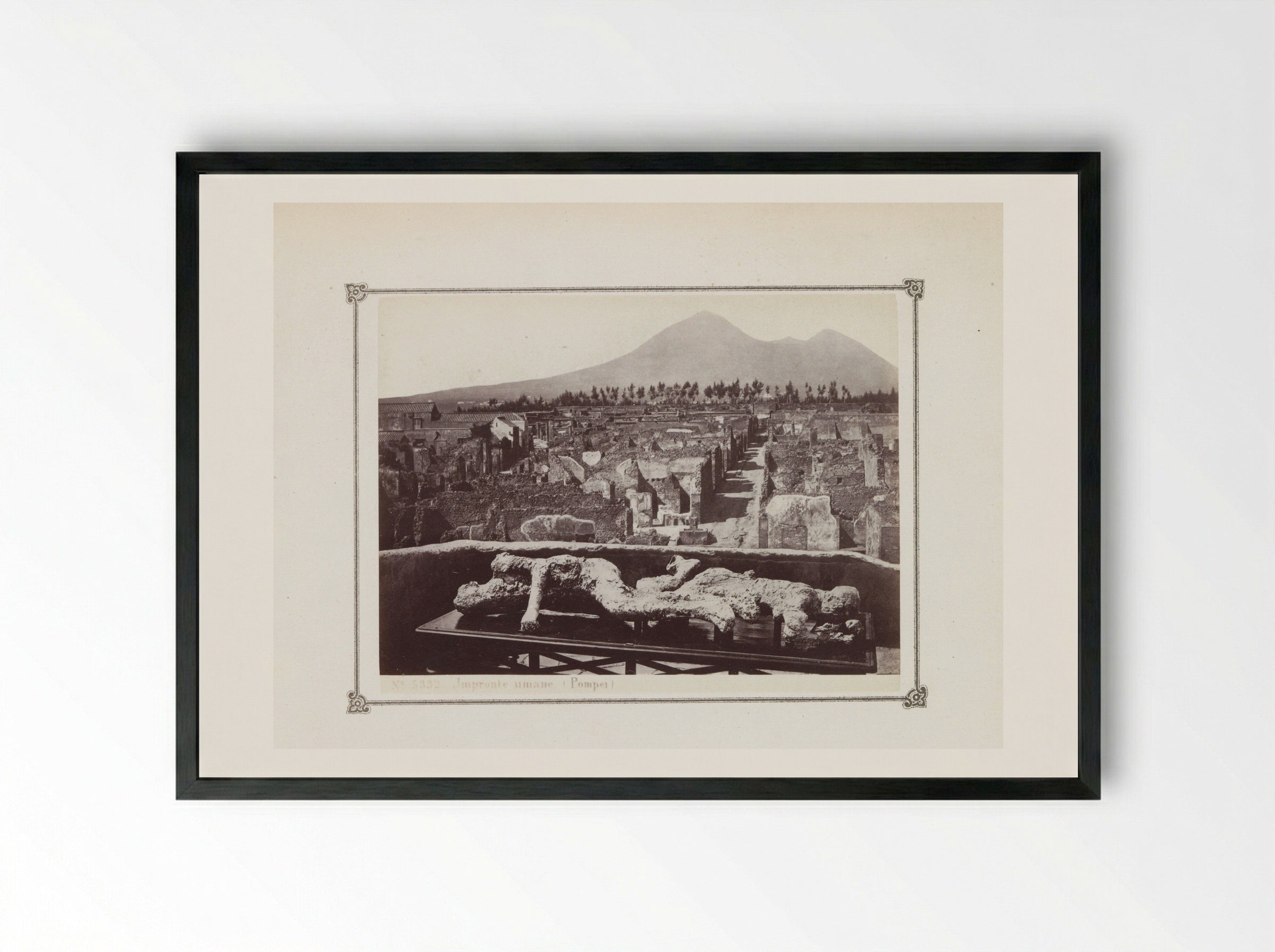 View of the Ruins of Pompeii with a Plaster Cast of a Victim in the Foreground - Giorgio Sommer - Framed Print Black