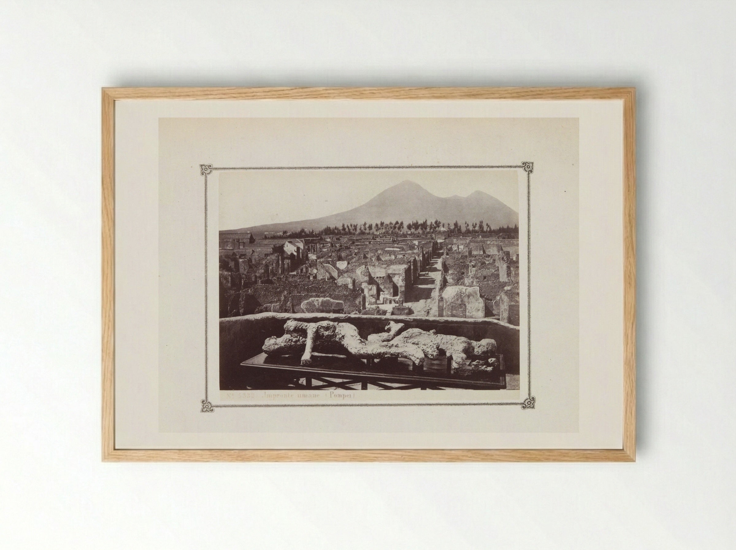 View of the Ruins of Pompeii with a Plaster Cast of a Victim in the Foreground - Giorgio Sommer - Framed Print Wood