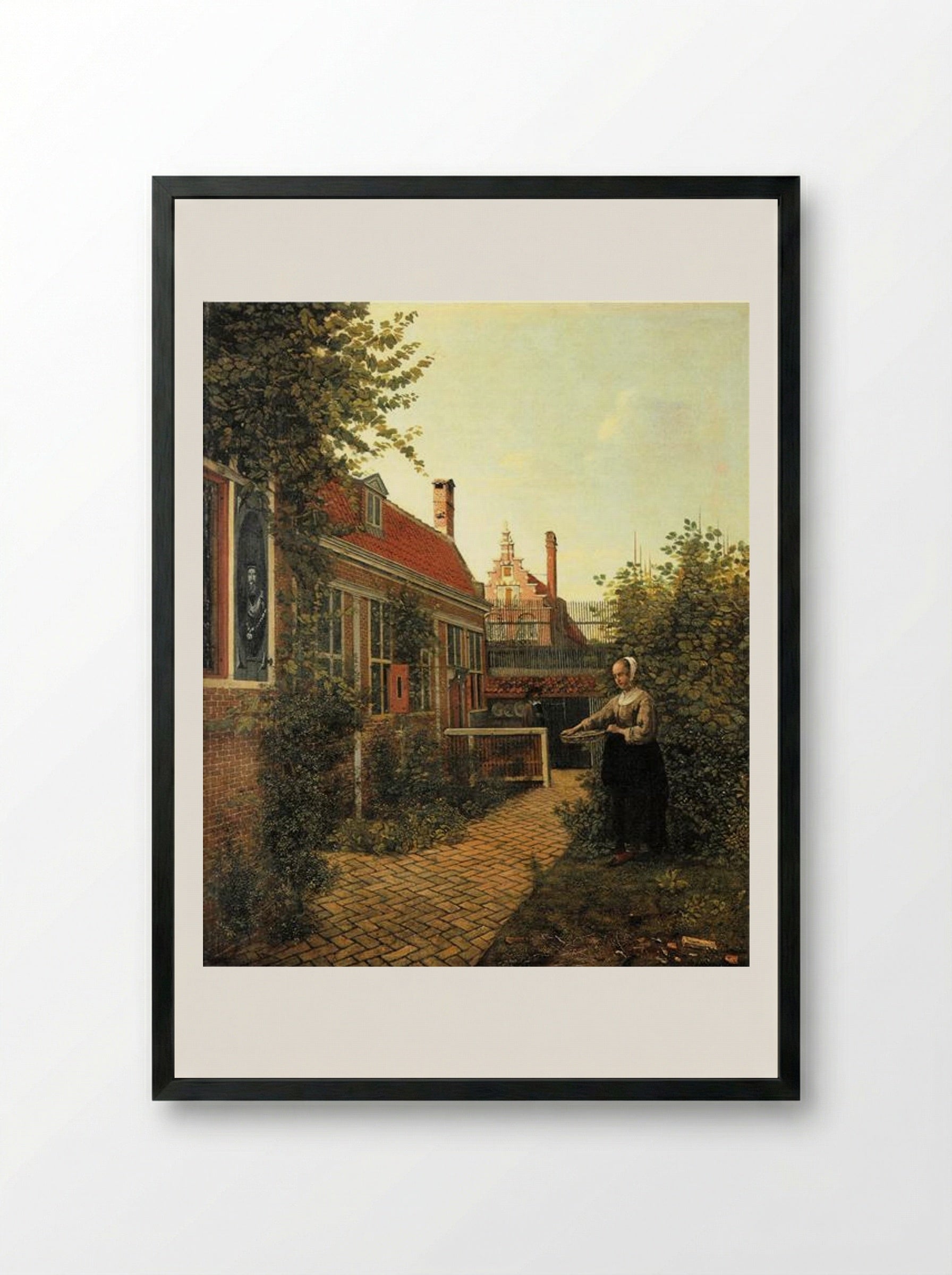 Woman with a Basket of Beans in a Kitchen Garden - Pieter de Hooch - Framed Print Black