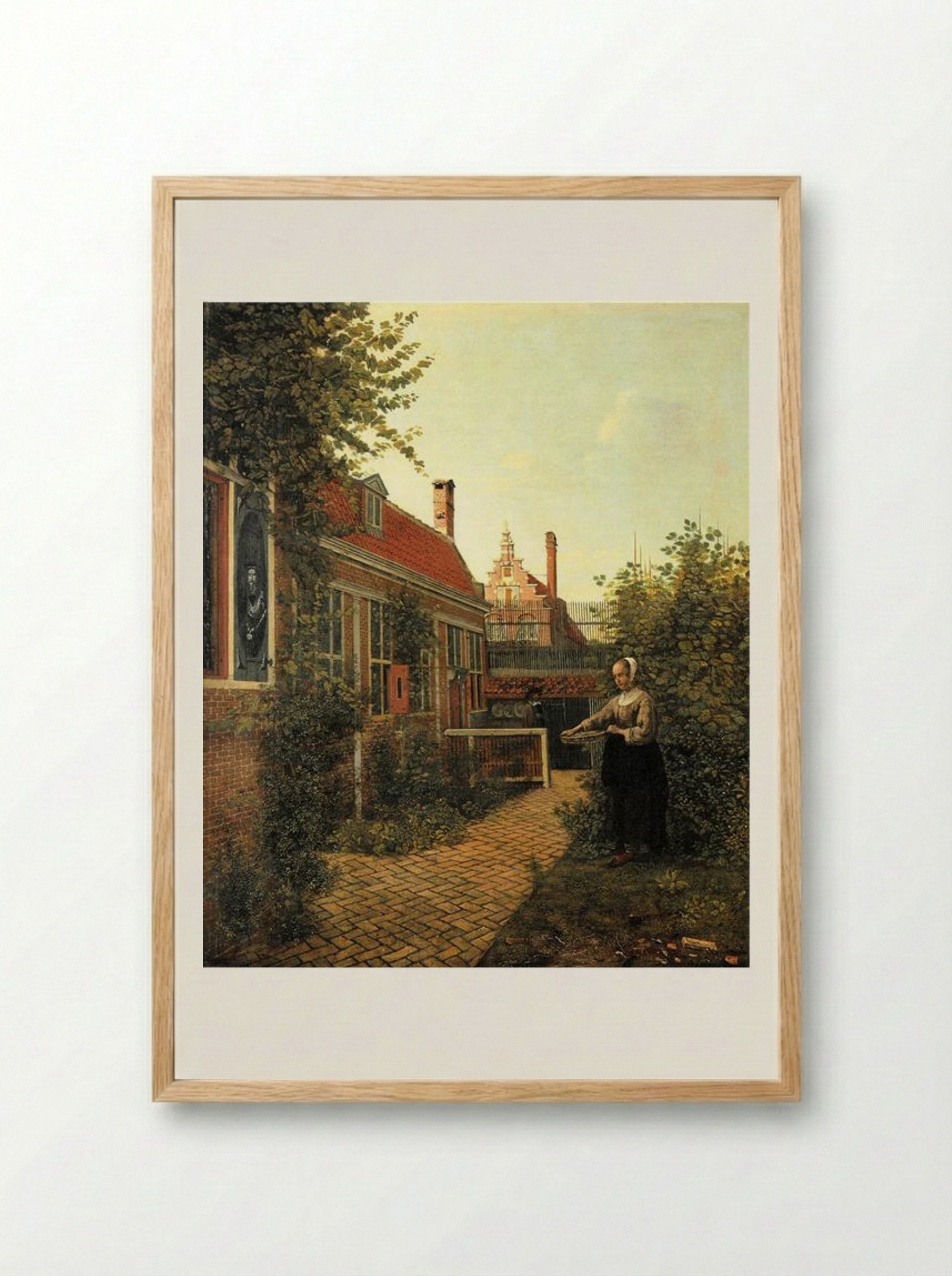 Woman with a Basket of Beans in a Kitchen Garden - Pieter de Hooch - Framed Print Wood