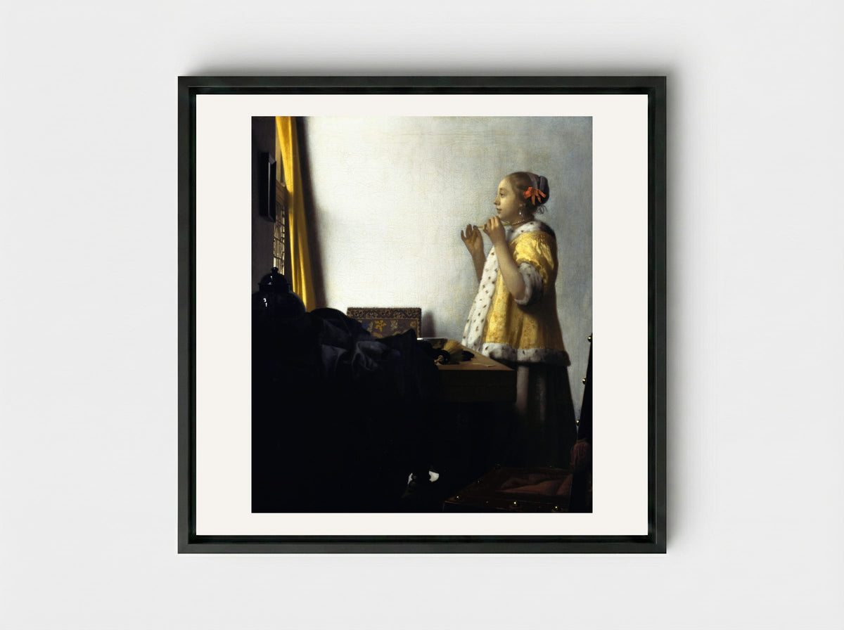 Young Woman with a Pearl Necklace - Johannes Vermeer - Framed Canvas Black
