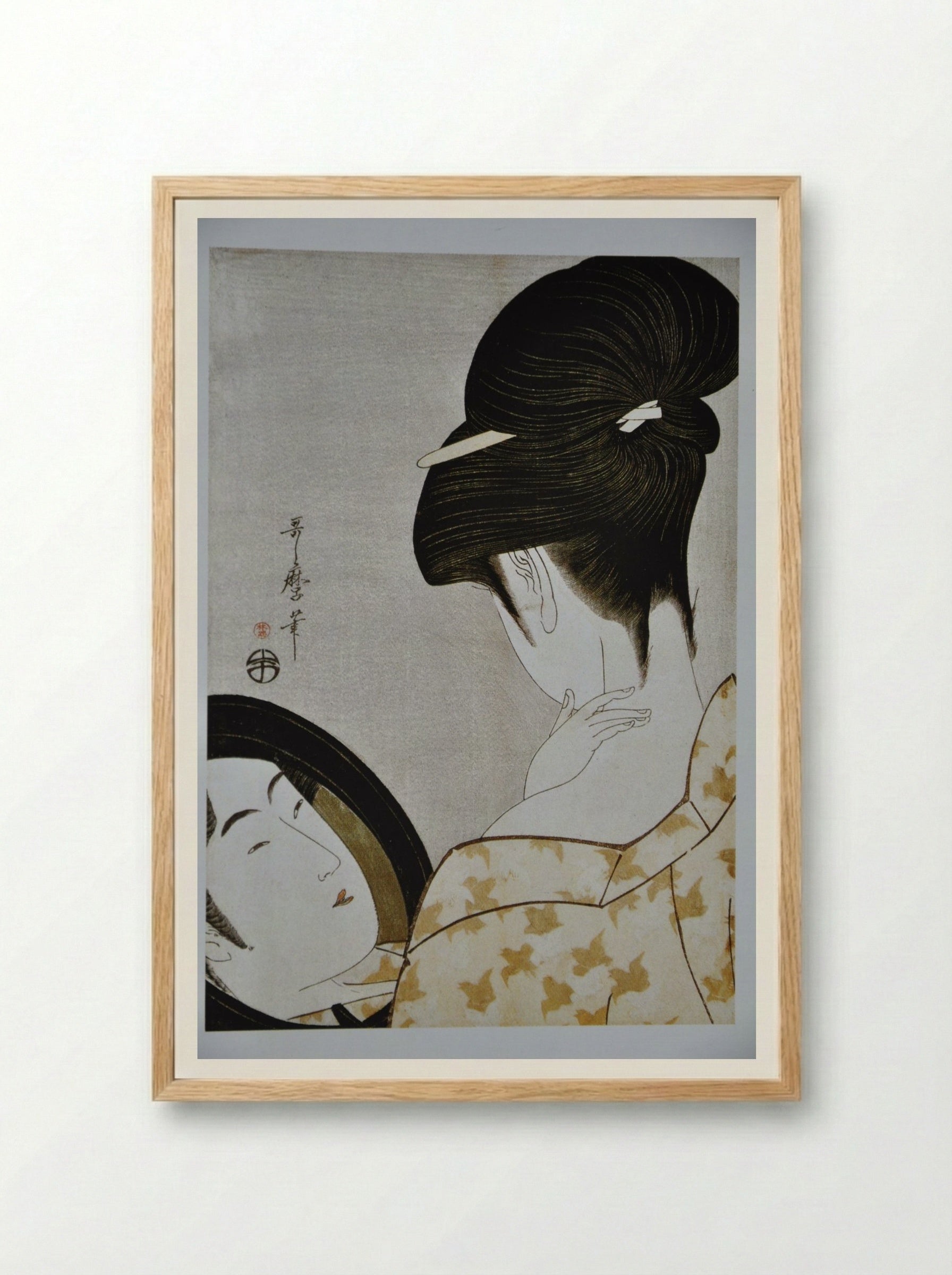 Young Woman Applying Makeup - Kitagawa Utamaro - Framed Print Wood