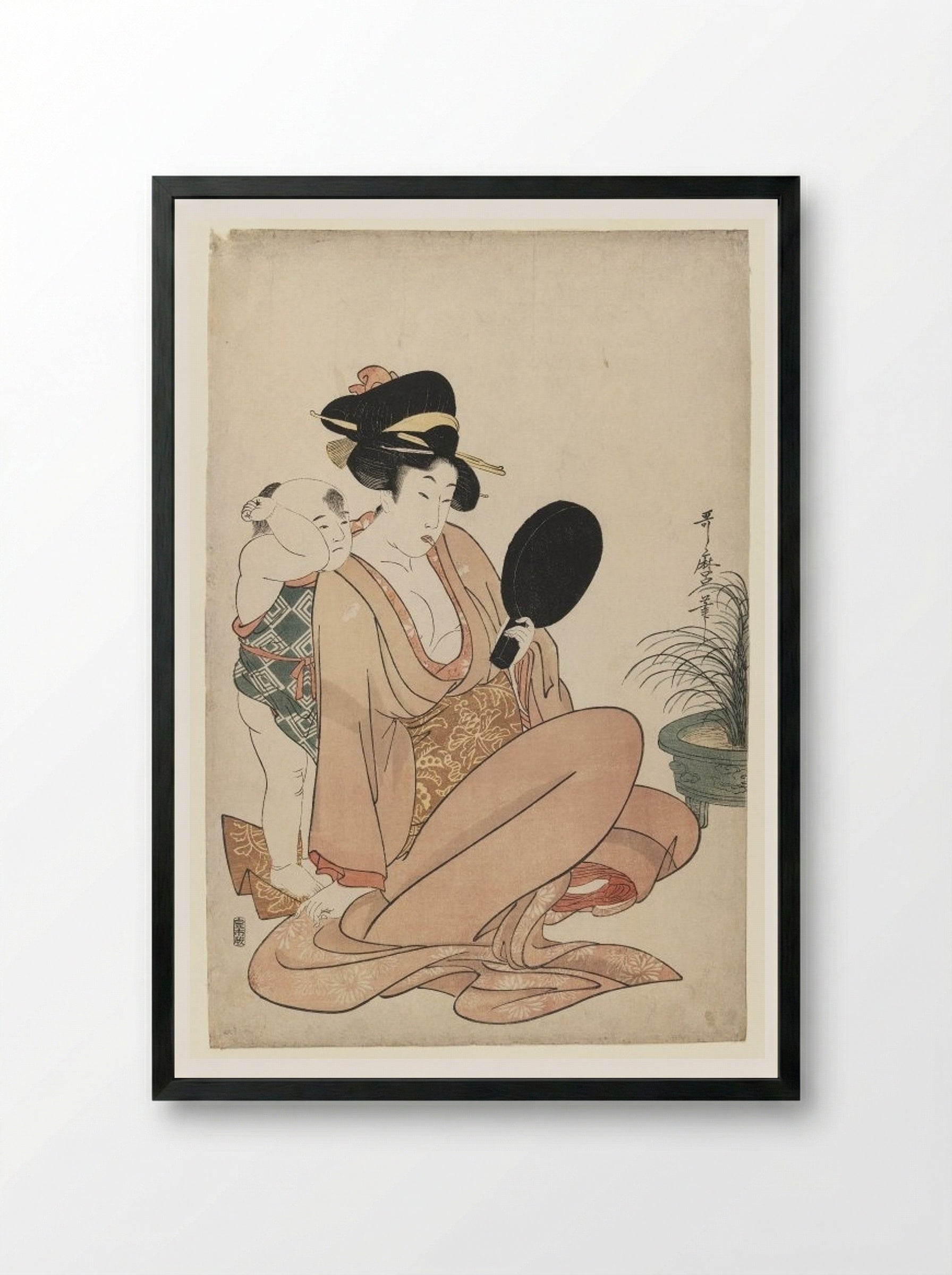Mother and Child Gazing at a Hand Mirror - Kitagawa Utamaro - Framed Print Black