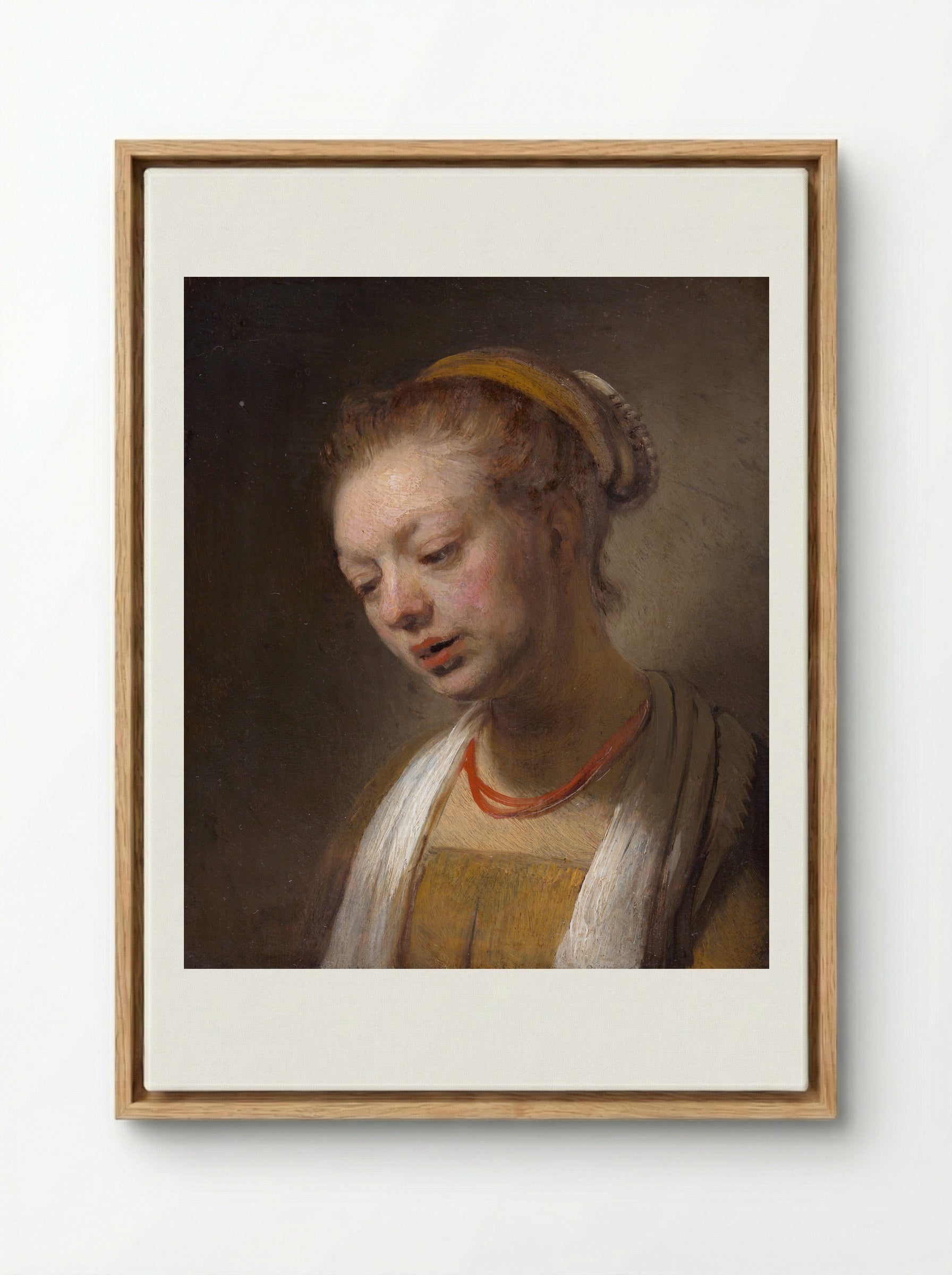 Young Woman with a Red Necklace - Rembrandt van Rijn - Framed Canvas Wood