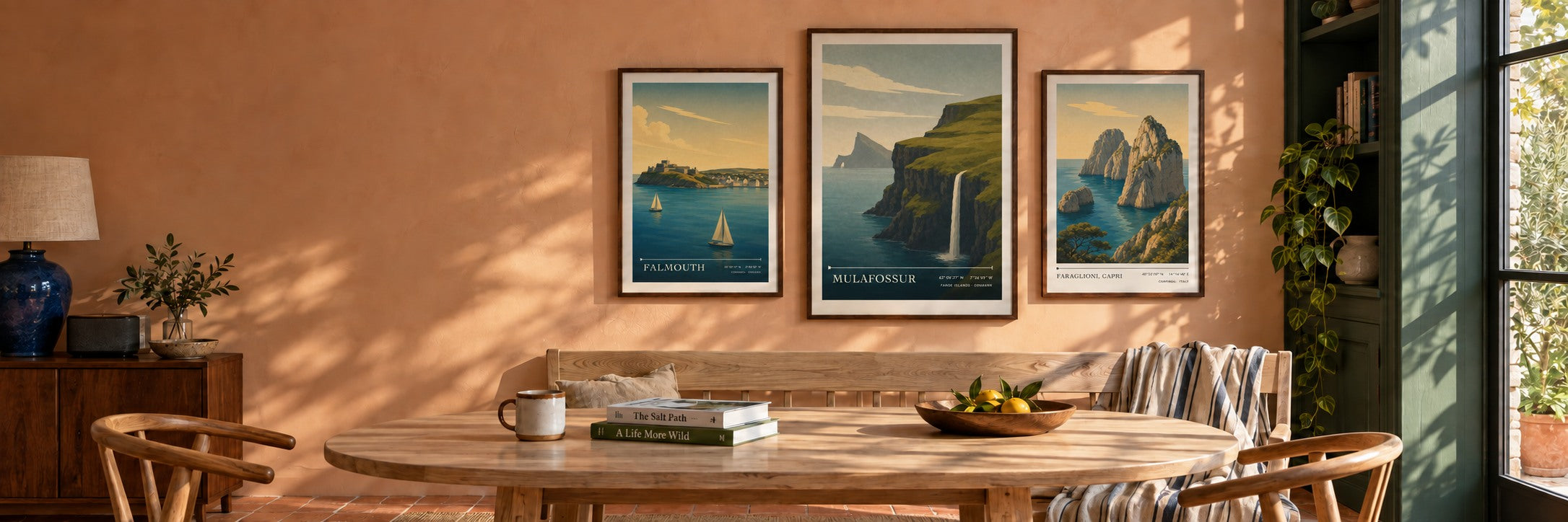 Falmouth, Mulafossur and Faraglioni travel posters in a sunlit contemporary dining room